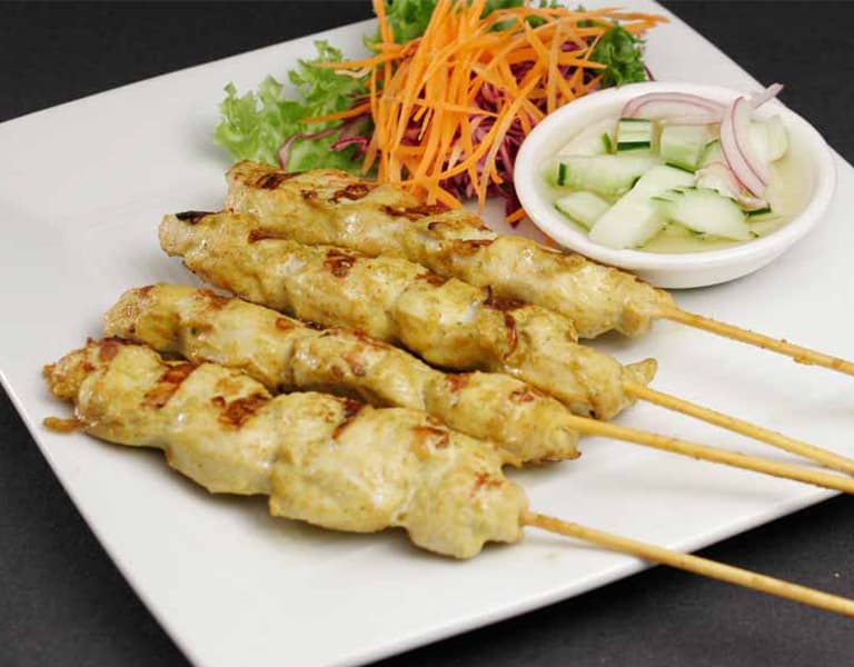 Chicken satay skewers with cucumber salad