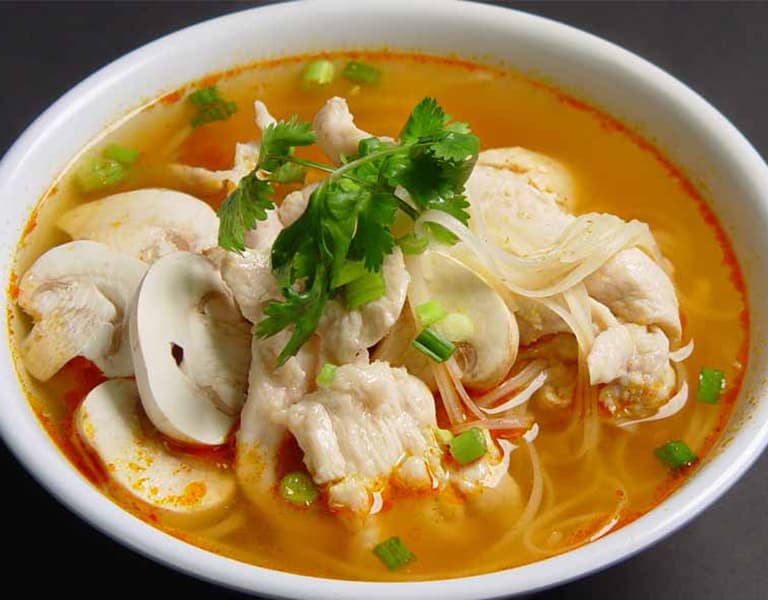 Tom Yum — hot and sour soup with chicken and mushrooms
